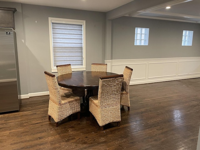 dining area featuring wainscoting, recessed lighting, wood finished floors, and a decorative wall