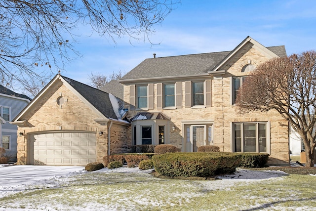 view of front of home with a garage, concrete driveway, brick siding, and a shingled roof