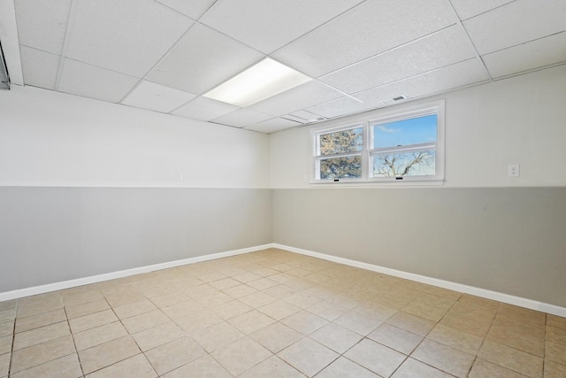 empty room with a paneled ceiling