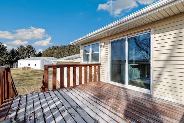 wooden terrace with a yard