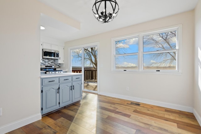 dining space featuring a chandelier and light hardwood / wood-style floors