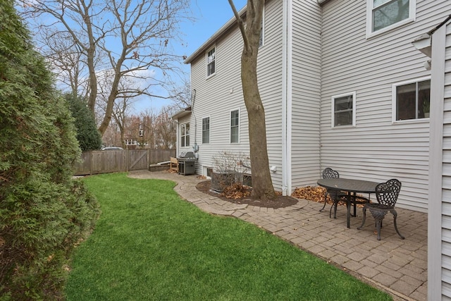 view of property exterior featuring a yard and a patio area