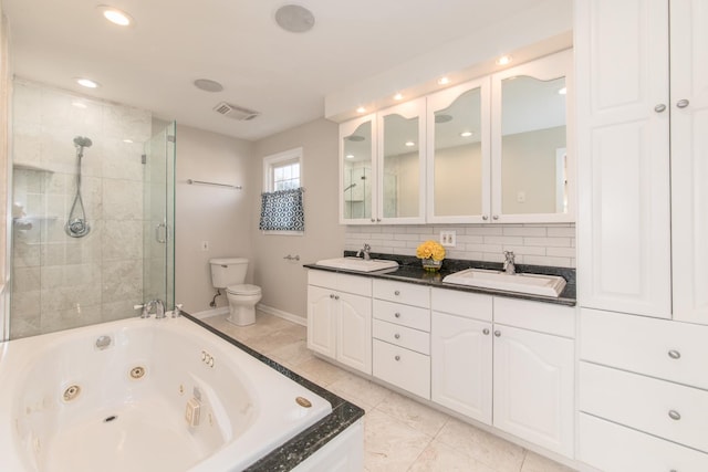 full bathroom featuring toilet, vanity, backsplash, and shower with separate bathtub