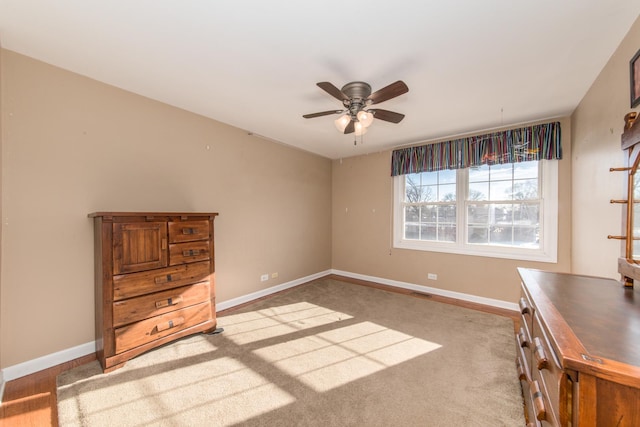 unfurnished bedroom featuring ceiling fan and light colored carpet