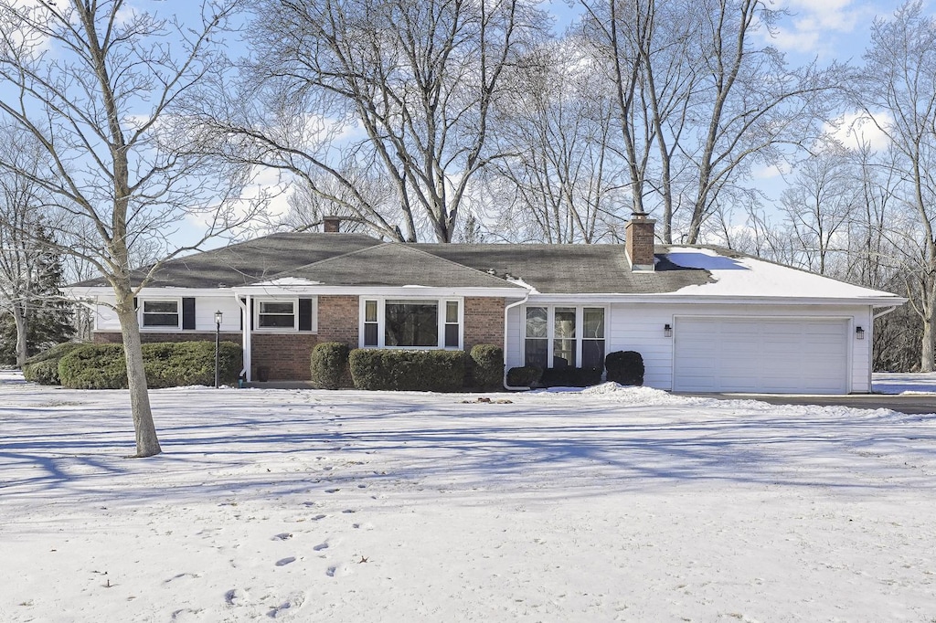 ranch-style house featuring a garage