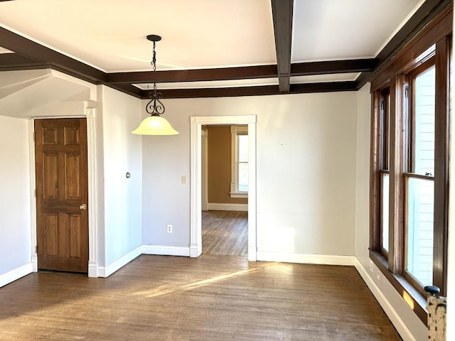 unfurnished dining area with dark wood-type flooring, a wealth of natural light, beamed ceiling, and coffered ceiling