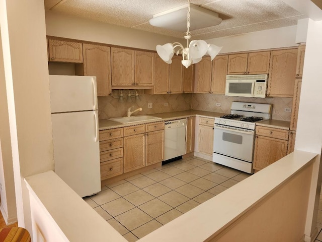 kitchen featuring pendant lighting, white appliances, decorative backsplash, a notable chandelier, and light tile patterned floors