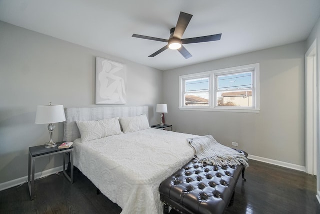 bedroom with ceiling fan and dark hardwood / wood-style flooring