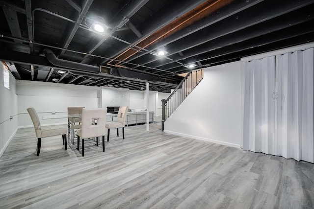 basement featuring wood-type flooring