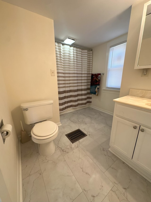 bathroom with toilet and vanity