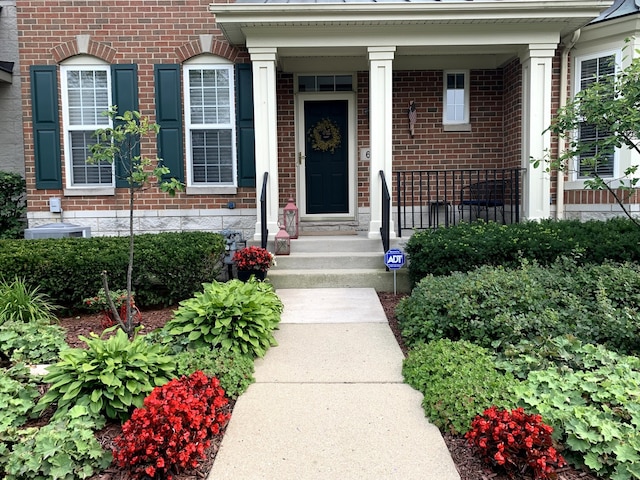 entrance to property featuring central AC unit