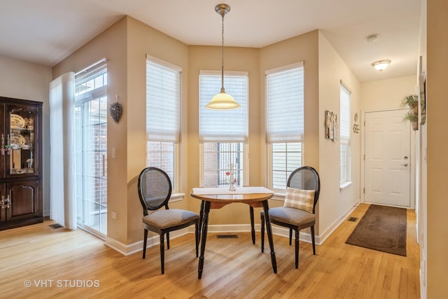 dining space featuring light hardwood / wood-style floors