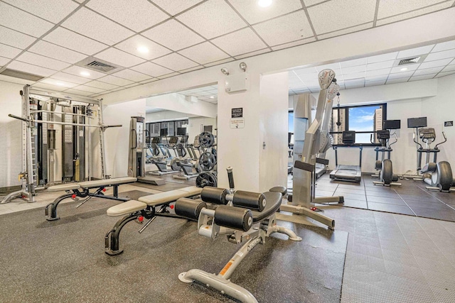 exercise room with a drop ceiling