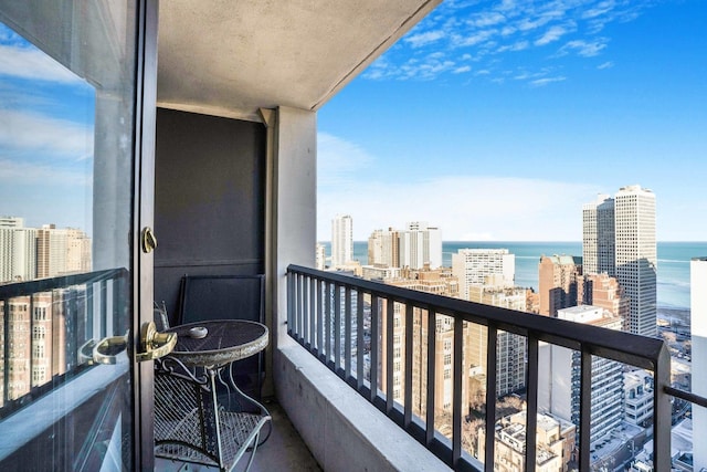 balcony featuring a water view