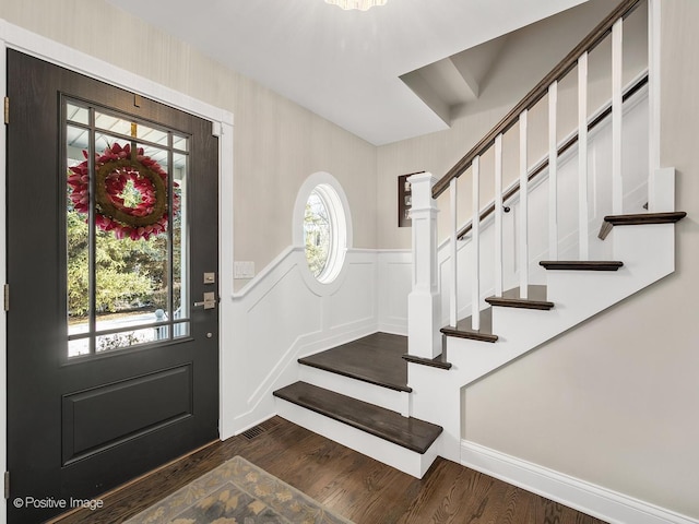 foyer with dark hardwood / wood-style floors