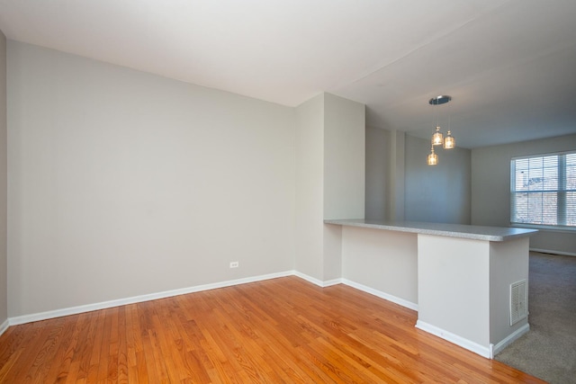 spare room with light wood-type flooring