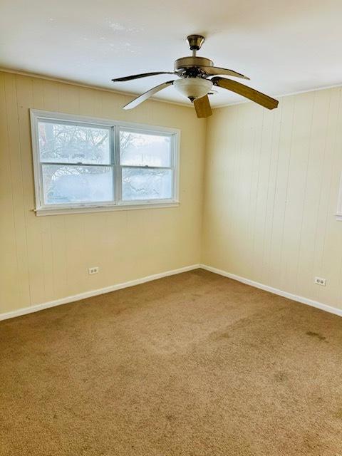 carpeted empty room with ceiling fan