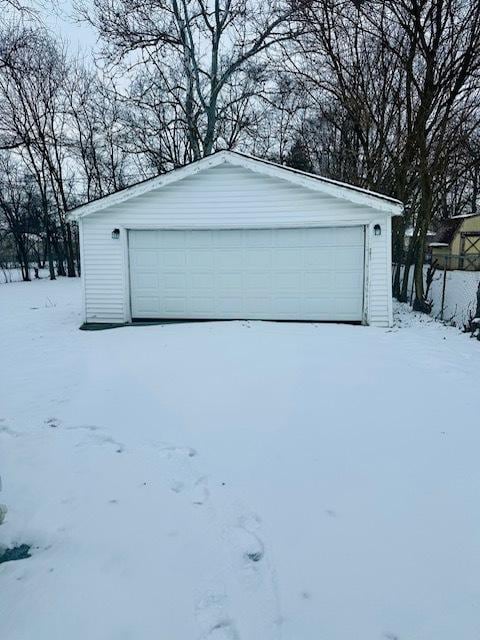 view of snow covered garage