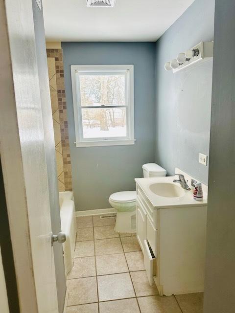 22012 Millard Ave, Richton Park, IL 60471 - kitchen with visible vents, light tile patterned floors, stainless steel fridge with ice dispenser, baseboards, and ornamental molding