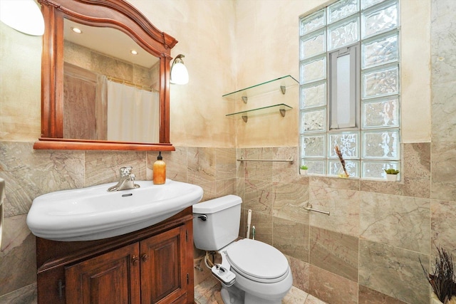 bathroom featuring a shower with shower curtain, tile walls, toilet, a wealth of natural light, and vanity