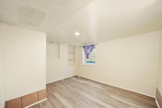 empty room with light hardwood / wood-style floors