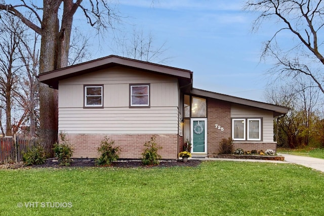 tri-level home with a front yard