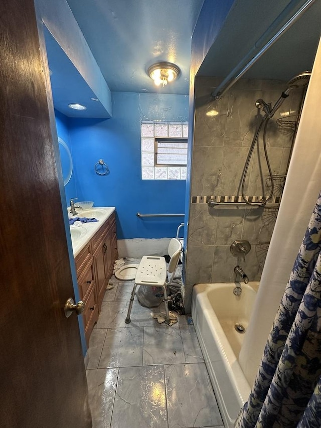 bathroom with vanity and shower / bath combo