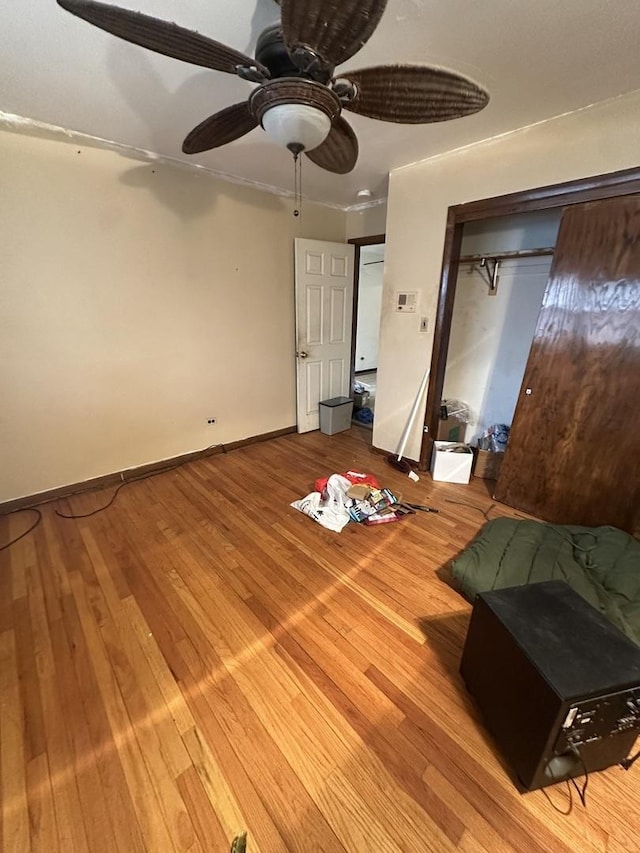 unfurnished bedroom with ceiling fan and hardwood / wood-style floors