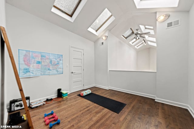 exercise area with lofted ceiling and dark hardwood / wood-style floors