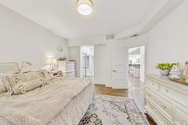 bedroom with hardwood / wood-style floors