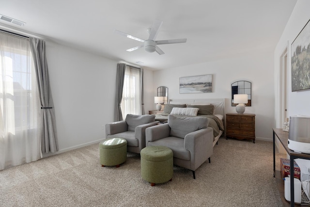 bedroom featuring ceiling fan and light colored carpet