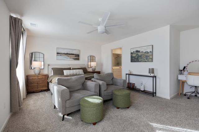 carpeted bedroom featuring ceiling fan and ensuite bathroom