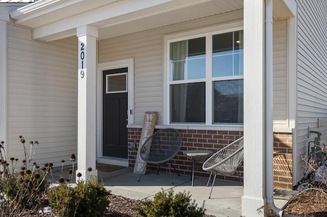 property entrance featuring covered porch