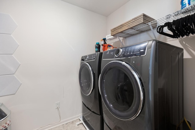 laundry room with independent washer and dryer