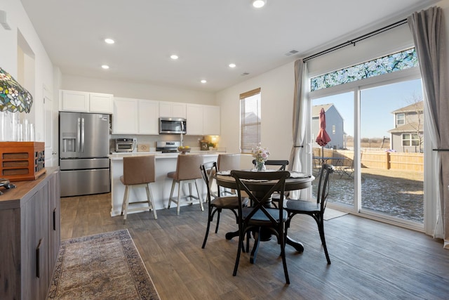 dining room with dark wood-type flooring