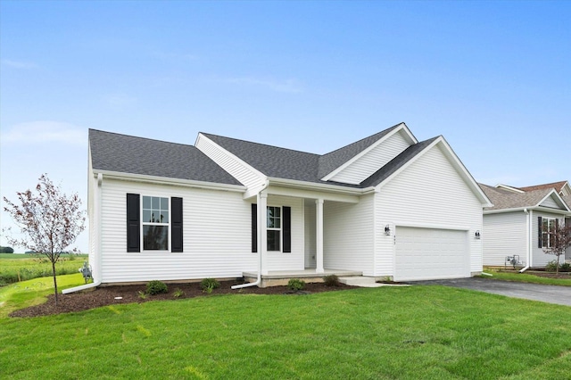 single story home featuring a garage, a porch, and a front lawn