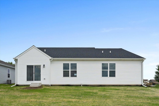 back of house featuring a yard