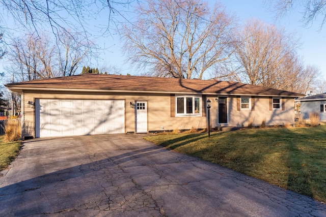 single story home featuring a front yard and a garage