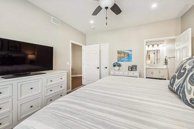 bedroom featuring ceiling fan and ensuite bathroom