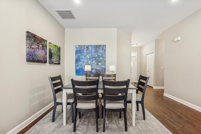 dining room with hardwood / wood-style flooring