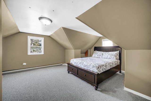 carpeted bedroom featuring baseboard heating, multiple windows, and lofted ceiling