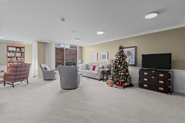 carpeted living room featuring crown molding