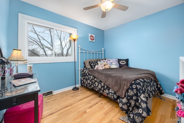 bedroom featuring ceiling fan and hardwood / wood-style flooring