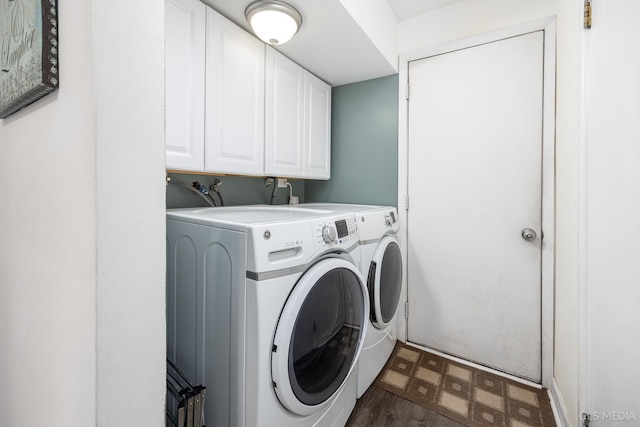 laundry area with cabinets and separate washer and dryer