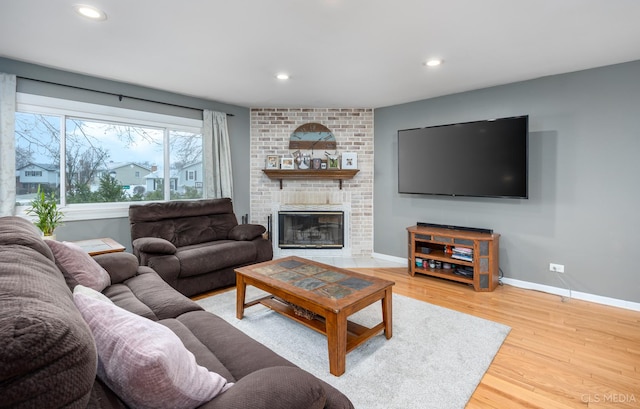 living room featuring a fireplace and hardwood / wood-style flooring