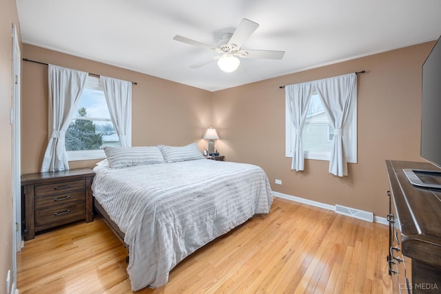 bedroom with light wood-type flooring and ceiling fan