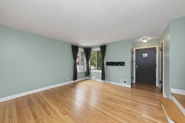 unfurnished room featuring light wood-type flooring