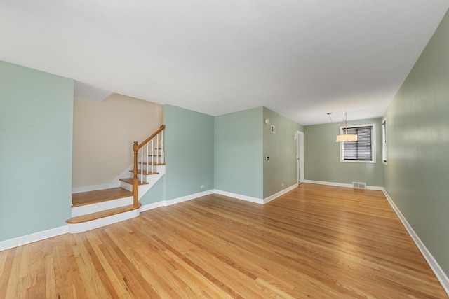 spare room featuring light hardwood / wood-style flooring