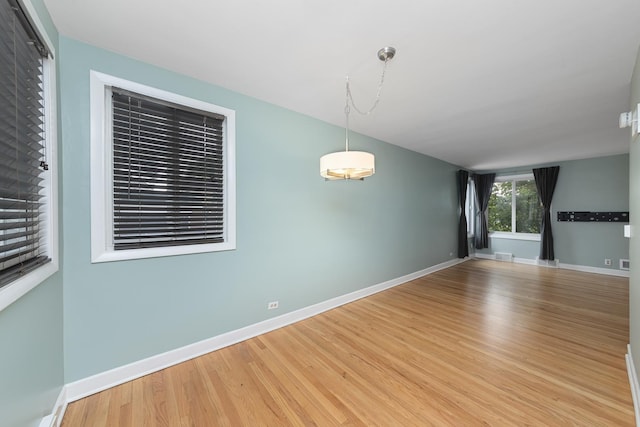 unfurnished room featuring light hardwood / wood-style flooring