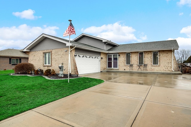 view of front facade with a garage and a front lawn